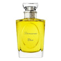Yellow Dior perfume bottle on a white background