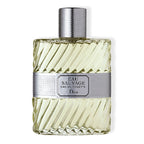 A glass bottle of Dior Eau Sauvage Originale Eau de Toilette with a label and cap, against a white background.