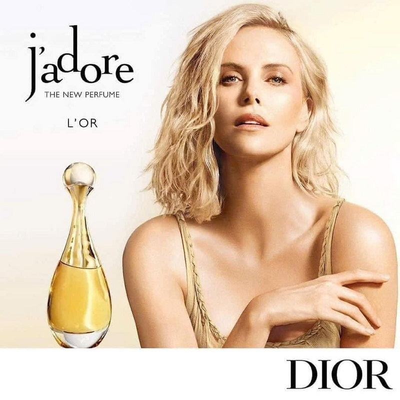 Advertisement for Dior j'adore perfume with a woman and the perfume bottle.