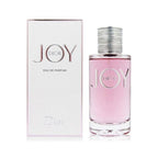 A product image featuring a 90ml bottle of Dior Joy Eau de Parfum by Christian Dior, with the bottle and packaging displaying the brand name 'Dior' and the scent name 'Joy'.