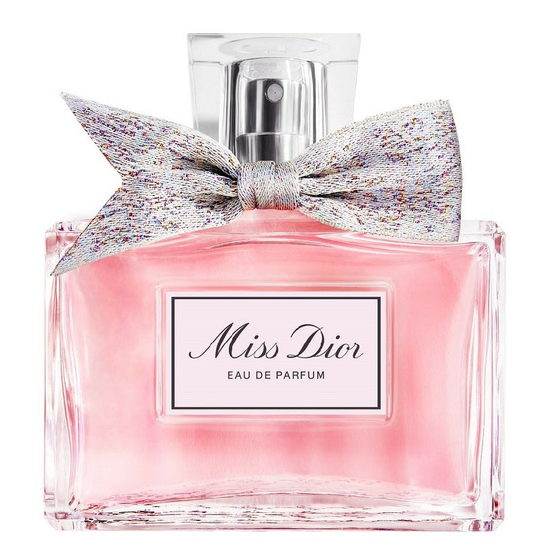 Miss Dior Eau de Parfum bottle with a decorative bow on a white background
