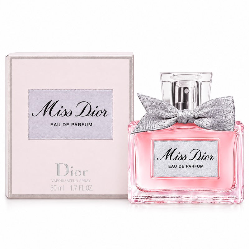 Dior Miss Dior Eau de Parfum 50ml spray bottle with a pink liquid and silver bow, shown next to its light pink packaging box.