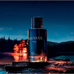 Dior Sauvage perfume bottle with a scenic background of a lake and mountains at night.