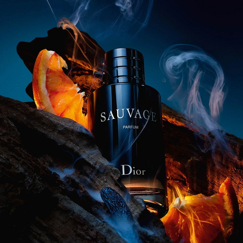 Dior Sauvage perfume bottle with orange peel and smoke effects on a dark background