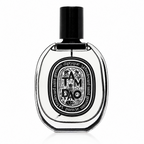 Diptyque Tam Dao Eau de Toilette bottle, featuring a clear glass body with a black cap and a detailed black and white label, set against a plain white background.