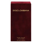 A red bottle of Dolce Pour Femme Eau de Parfum by Dolce & Gabbana with a gold cap and branding details.