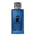 Blue Dolce & Gabbana perfume bottle with decorative cap on a white background
