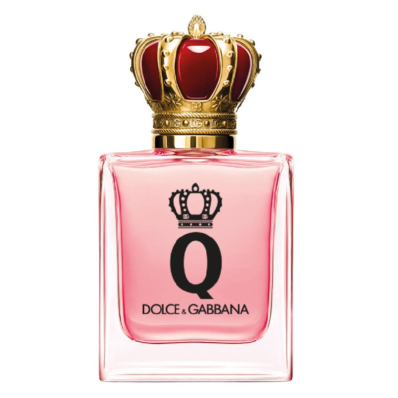 A glass bottle of Dolce Q-Queen eau de parfum by Dolce Gabbana with a pink liquid visible and a gold crown on the cap.