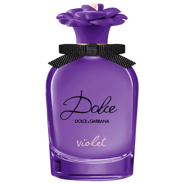 A purple bottle of Dolce Violet perfume by Dolce Gabbana with a floral design on the bottle and a black bow at the top.