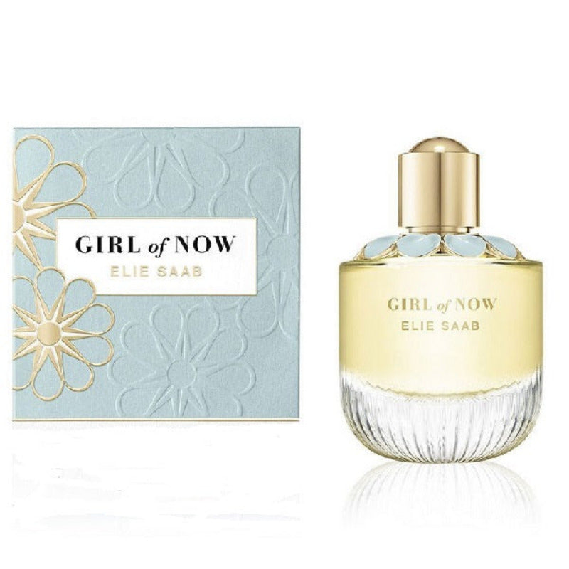 A product image featuring the packaging and bottle of 'Girl of Now' eau de parfum by Elie Saab for women. The packaging is a blue box with gold floral details, and the clear bottle has gold accents on the cap and label.