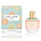 The image shows the product packaging and bottle of 'Girl of Now Lovely' Eau De Parfum by Elie Saab for women. The packaging is predominantly pink with floral designs, and the bottle has a gold cap.