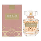 A product image featuring a pink box and a clear bottle of Elie Saab Le Parfum Essentiel Eau De Parfum with a gold cap. The packaging has gold geometric patterns.