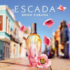 Escada Brisa Cubana perfume bottle with pink flowers on a blurred street background