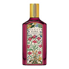 Gucci Flora perfume bottle with floral design on a white background