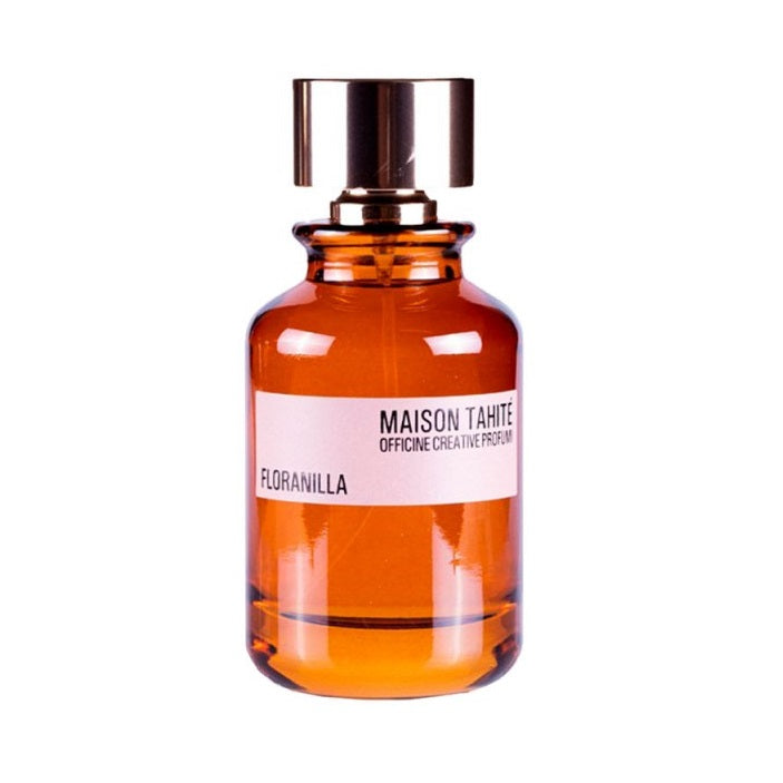Amber glass perfume bottle with a white label on a white background