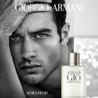 Image of a model lying next to a bottle of Acqua Di Gio