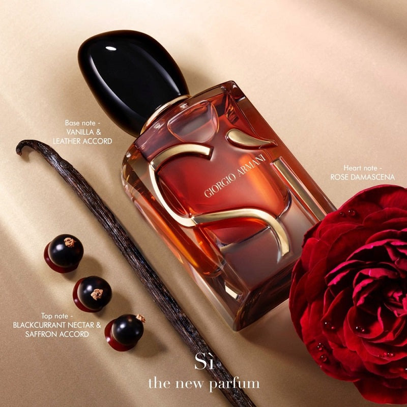 Giorgio Armani perfume bottle with vanilla bean, blackcurrant, and red rose on a beige background
