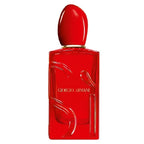 Red Giorgio Armani perfume bottle on a white background