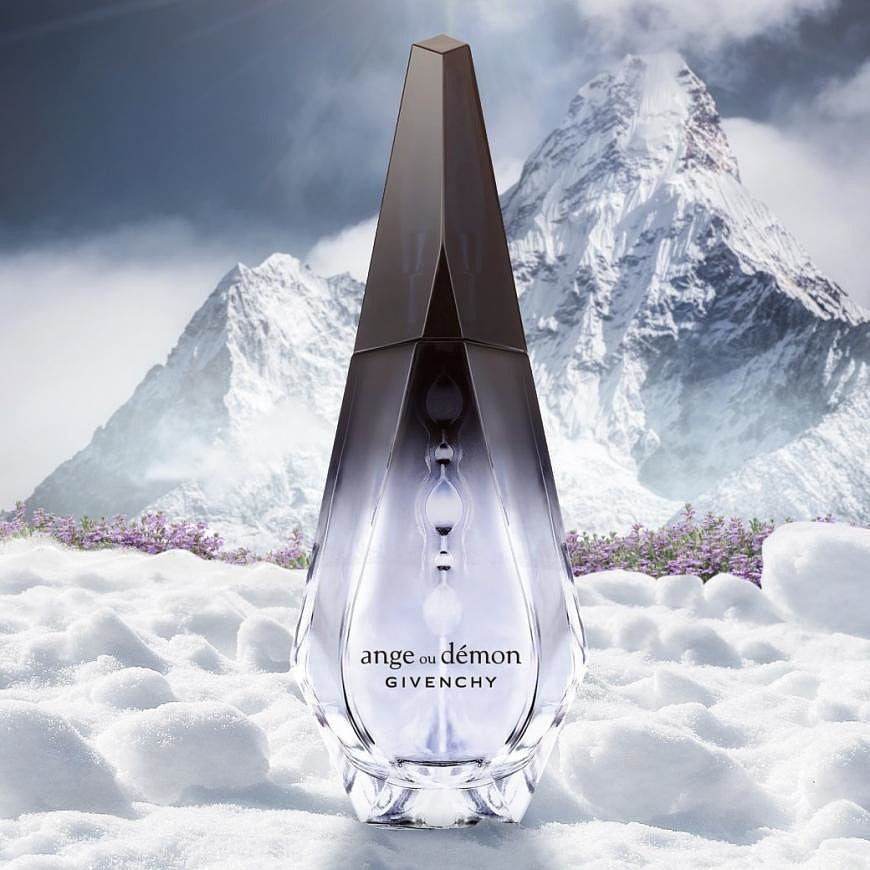 Givenchy perfume bottle with mountainous background