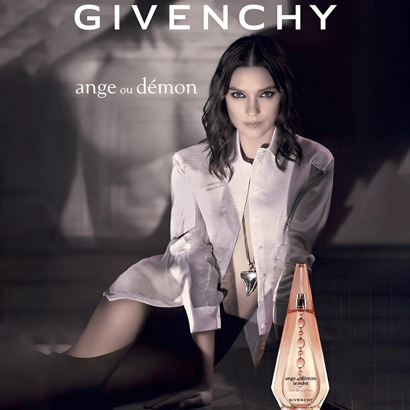Givenchy perfume advertisement with a model and the product.