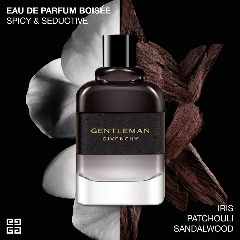 Gentleman Givenchy perfume bottle with patchouli figs on a black background