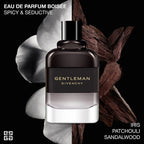 Gentleman Givenchy perfume bottle with patchouli figs on a black background
