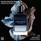Gentleman Givenchy perfume bottle with floral and wooden elements on a black background
