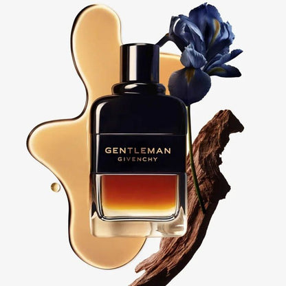 Gentleman Givenchy perfume bottle with a blue flower on a white background