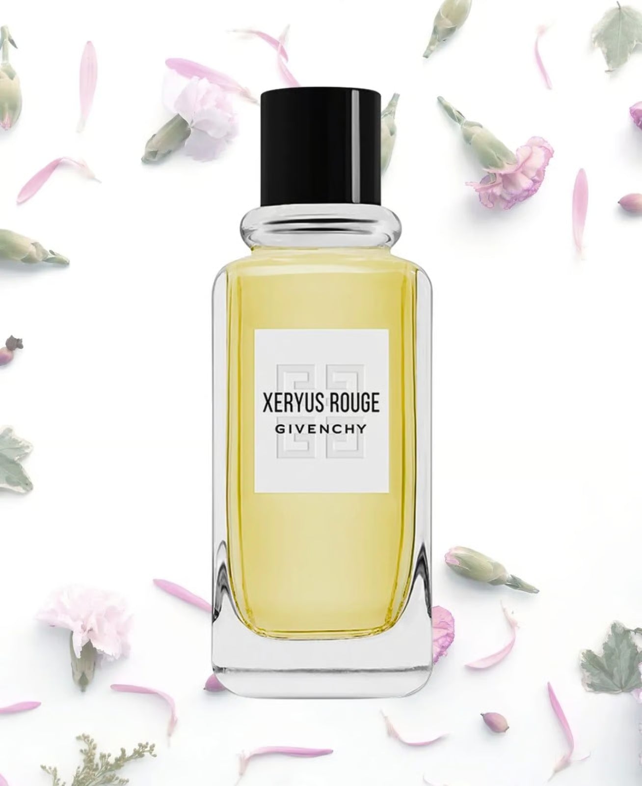 Givenchy Xeryus Rouge perfume bottle on a white background with flowers.