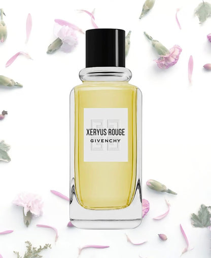 Givenchy Xeryus Rouge perfume bottle on a white background with flowers.
