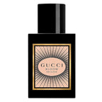 A black bottle of Gucci Bloom Intense Eau de Parfum with a gold and pink label.