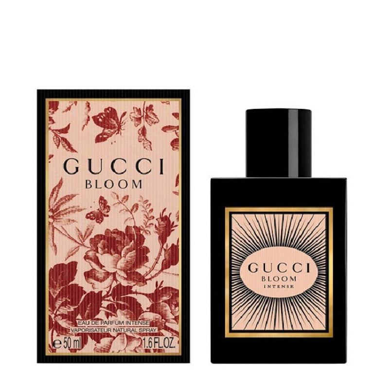 Gucci Bloom Intense Eau De Parfum bottle and packaging, featuring a floral motif on the box with a butterfly, and the Gucci logo prominently displayed.