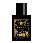 Gucci Bloom perfume bottle with black and gold design on a white background