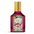 Gucci Flora perfume bottle with floral design on a white background