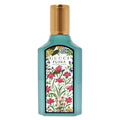 Gucci Flora perfume bottle with floral design on a white background