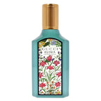 Gucci Flora perfume bottle with floral design on a white background