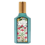 Gucci Flora perfume bottle with floral design on a white background