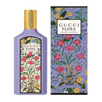Gucci Flora Gorgeous Magnolia Eau De Parfum bottle and packaging, featuring a purple bottle with a floral label and a gold cap, alongside the product box with a matching design.