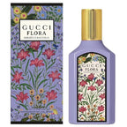 Gucci Flora Gorgeous Magnolia Eau De Parfum bottle and packaging, featuring a purple container with floral patterns and a gold cap.