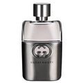 A bottle of Gucci Guilty for Men Eau de Toilette with a silver cap and a clear, slightly curved bottle displaying the Gucci logo.