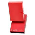 Red Gucci Rush perfume box on a white background