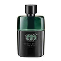 A bottle of Gucci Guilty Black Pour Homme eau de toilette with a black and green color scheme.
