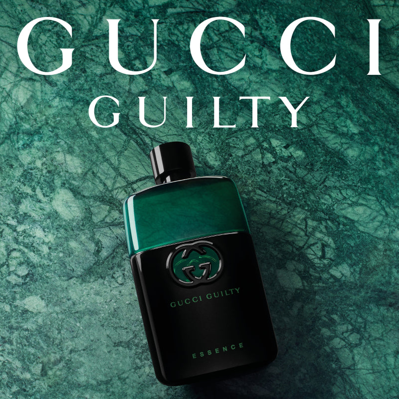 Gucci Guilty perfume bottle on a green marble background