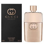 Gucci Guilty Pour Femme Eau De Toilette bottle and packaging, with black and gold colors and the Gucci logo
