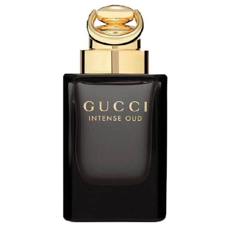 Gucci Intense Oud perfume bottle with gold cap on a white background