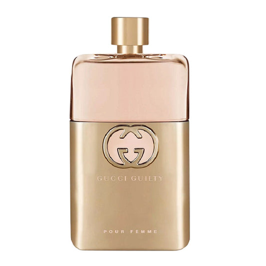 Gold Gucci perfume bottle on a white background