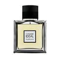 A square-shaped bottle of Guerlain L'Homme Ideal Eau de Toilette with a black cap and clear liquid visible inside.
