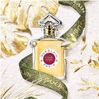 Perfume bottle with gold and white decorative background