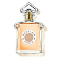 A glass bottle of Guerlain Idylle Eau de Parfum with a gold-colored cap and a label featuring the brand name and fragrance name.