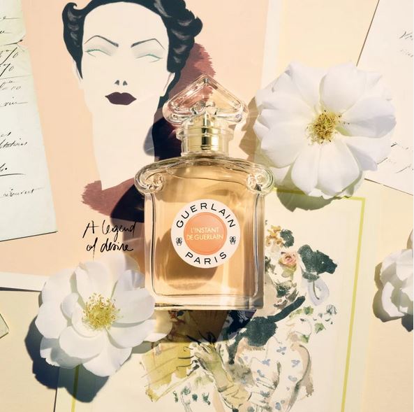 Perfume bottle with white flowers and artistic background